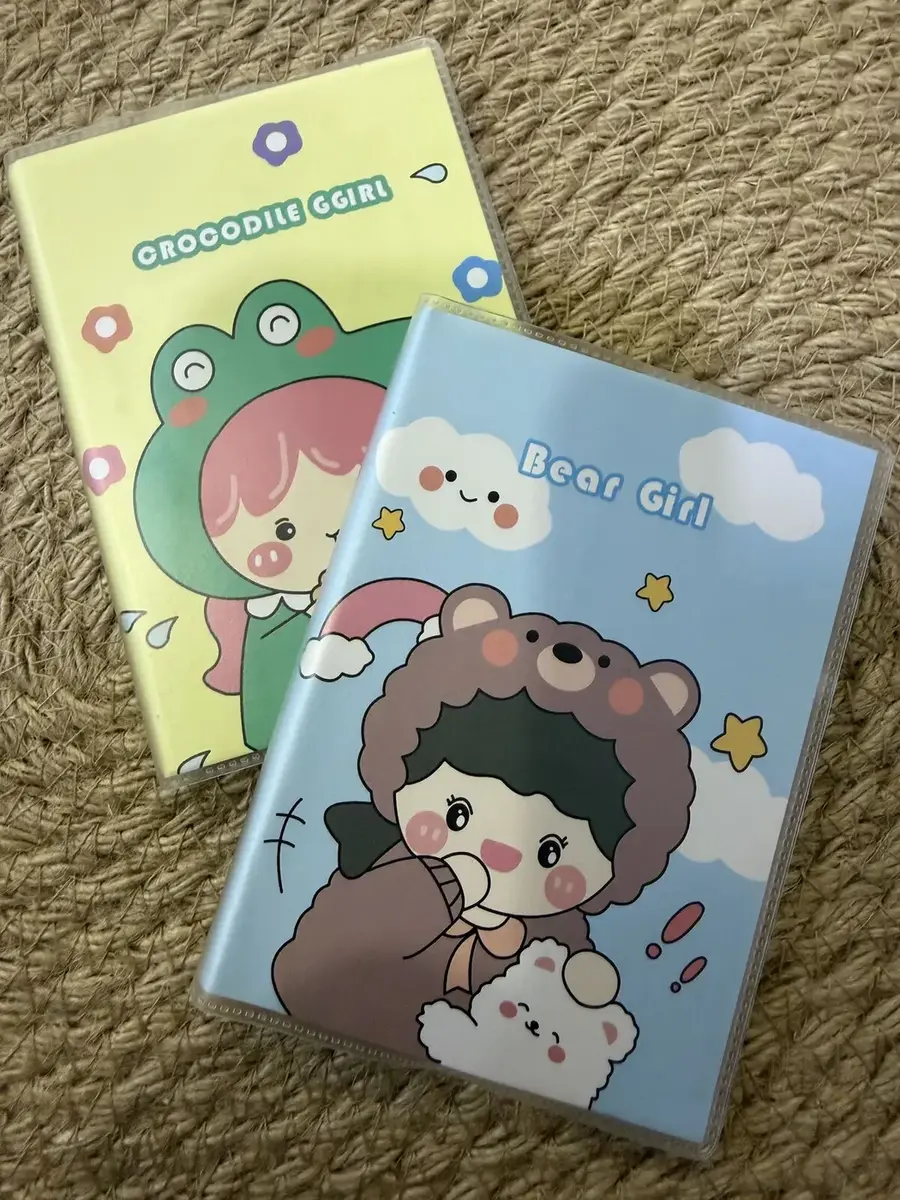 Two notebooks, with Crocodile Girl and Bear Girl covers.