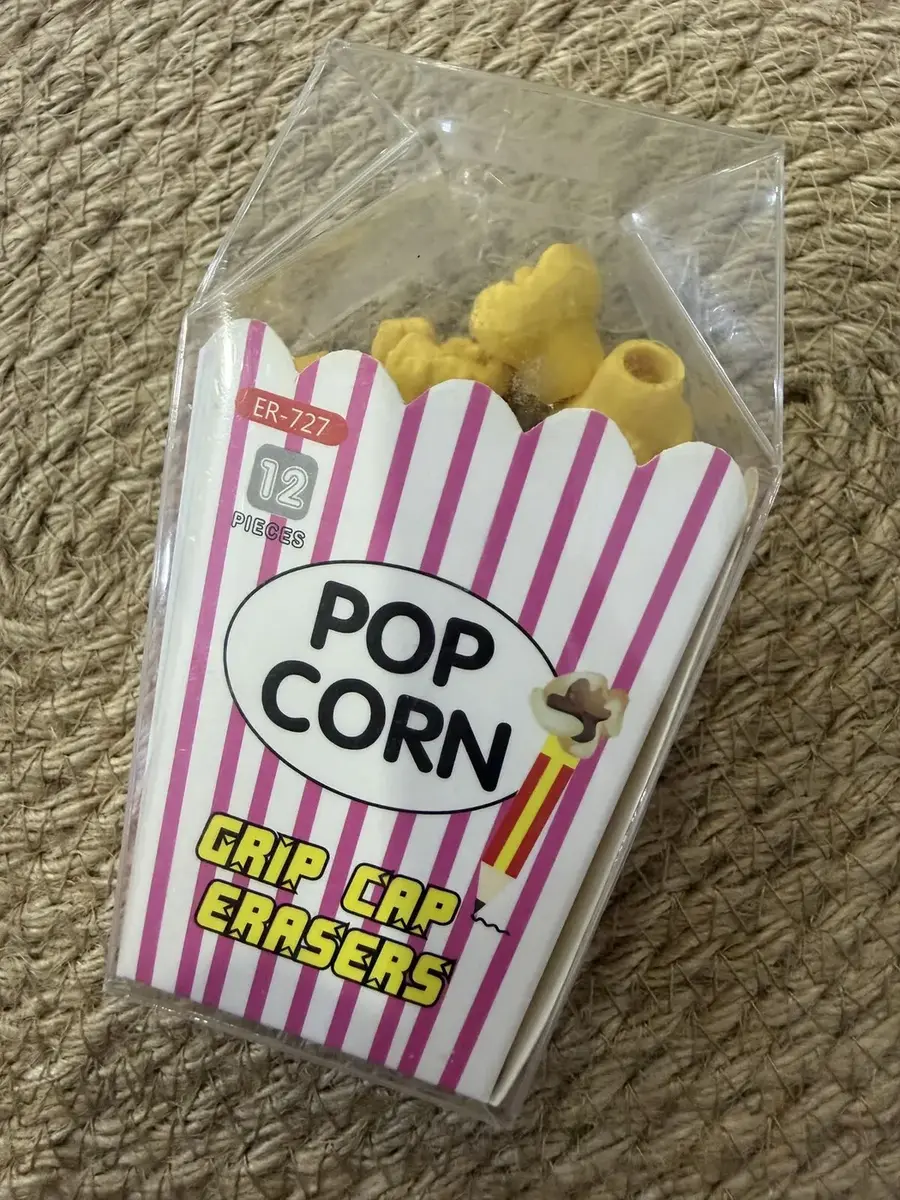 A popcorn box of erasers labelled Crisp Cap Erasers.