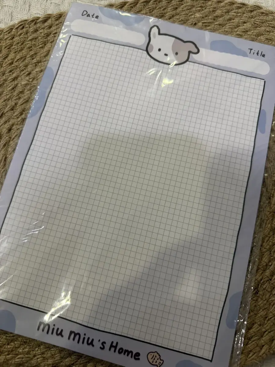 A grid memo pad, miu miu's Home.