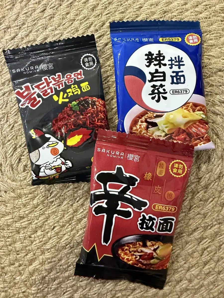 Three erasers shaped like Korean instant-noodle packs.